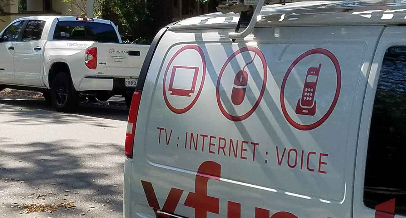 Buchan Consulting LLC Trucks alongside Comcast Xfinity Trucks